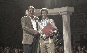 Marty Paulsen (l), chapter vice president for education, presents Travis Stansbery, San Clemente High School, with a $1,000 scholarship check in June.